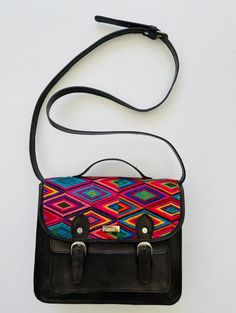 High quality colorful leather embroidered crossbody bag. This is a one of a kind purse that complements any outfit. Wear it for daily use or dress it up. Length: 10 3/4 inches Width: 3 inches Height: 9 inches Strap: Adjustable Visit us at Omxboutique on Instagram Multicolor Embroidered Crossbody Shoulder Bag With Adjustable Strap, Multicolor Leather Saddle Bag For Daily Use, Multicolor Crossbody Saddle Bag For Travel, Multicolor Crossbody Saddle Bag With Adjustable Strap, Multicolor Shoulder Saddle Bag For Daily Use, Multicolor Crossbody Saddle Bag For Everyday Use, Artisan Crossbody Saddle Bag With Adjustable Strap, Artisan Saddle Bag With Adjustable Strap, Leather Bag With Multicolor Embroidery For Everyday Use