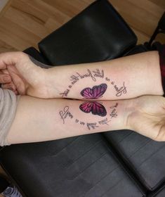 two people with matching tattoos on their legs, one has a butterfly and the other has a quote