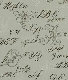 the letters and numbers are drawn in black ink on a white paper with an ornate design