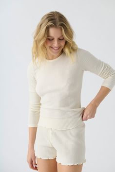 Women's ivory rib knit fitted long sleeve top & curly-edge hem Textured Knit Long Sleeve Top, Long Sleeve Textured Knit Top, Textured Knit Long Sleeve Top For Layering, Long Sleeve Textured Knit Sweater For Daywear, Chic Textured Knit Daywear Tops, Chic Textured Knit Tops For Daywear, Textured Long Sleeve Tops For Fall, Textured Knit Long Sleeve Sweater For Daywear, Spring Textured Tops For Loungewear