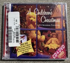 a cd case with a teddy bear and christmas decorations on it