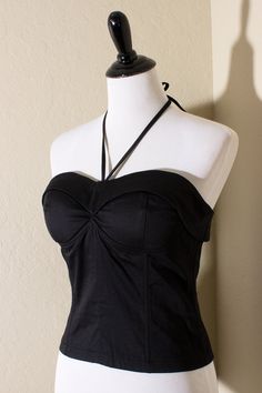 This stunning bustier top features black cotton fabric with padded cups, boning and elastic shirring on the back for a perfect fit! Zip up back with a cute V tie. Also did you notice the cute fold over bustline? 100% cotton with lining. Imported. Cute V, Black Cotton Fabric, Digital Closet, Pop Style, Bustier Top, Edgy Outfits, Dream Clothes, Fold Over, Cute Tops