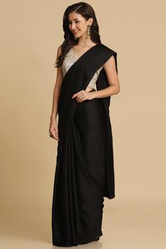 Product Features: Saree: Saree as seen in picture - Choose the drape style while order: Standard, Pleated or Gujarati Saree Fabric: Satin Saree Color: Black Saree Work: Plain Saree Border And Pallu: Borderless And Plain Pallu Blouse: Blouse Design Must Be Chosen While Ordering. For The Blouse In Pic, Please Choose The Selection "As Seen In Picture" Or Customize Your Selection Blouse Fabric: Brocade Blouse Color: Off White Blouse Work: Plain Wash: Dry Clean Occasion: Party Disclaimer: There Will White Work Blouse, Satin Sarees, One Minute Saree, Off White Saree, Formal Saree, Brocade Saree, Sarees For Girls, Saree Bollywood, Plain Saree