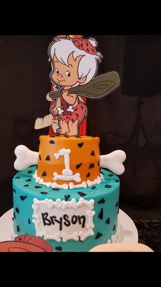 a birthday cake with an image of a boy holding a baseball bat on top of it