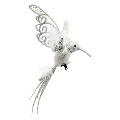 a white bird flying through the air with its wings spread