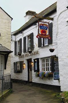 the building has many windows and signs on it