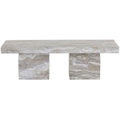 a white marble bench sitting on top of a wooden table