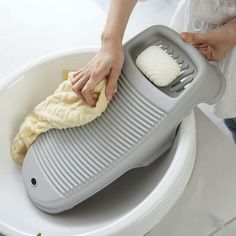 a person using a banana peeler on top of a sink