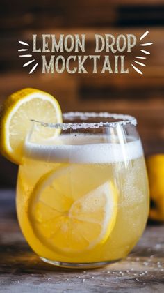 a lemon drop cocktail in a glass with ice and garnish on the rim