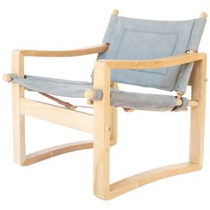 a wooden chair with grey fabric on it