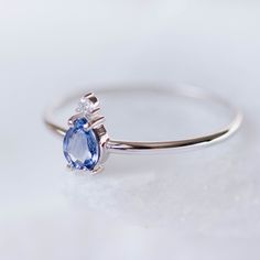 A 14K gold ring with a natural sapphire gemstone pear cut and a diamond brilliant cut in white gold or in yellow gold. A perfect engagement gold ring for women, stacking and delicate that adds glam to every outfit. Sapphire is the birthstone of September. 100% handcrafted with love! D E T A I L S ● Metal: 14K solid white gold, 14K gold, 14K rose gold ● Gemstones: Sapphire, Diamond ● Gemstones weight: Sapphire 0.4ct, Diamond 0.02ct ● Sapphire dimensions: 5.4 x 4.2 mm R I N G ∙ S I Z I N G For Gen Formal Pear-shaped Sapphire Ring, Fine Jewelry Sapphire Ring With Pear Shape, Fine Jewelry Pear-shaped Sapphire Ring, Pear-shaped Sapphire Ring, Pear-shaped Birthstone Promise Ring, Pear-shaped Sapphire Ring With Diamond Accents, Teardrop Sapphire Ring In White Gold, Sapphire Pear Shaped Rings For Anniversary, Pear Shaped Sapphire Rings For Anniversary