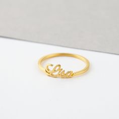 "** STACKABLE NAME RING - MEGAN FONT, made from sterling silver and available in 18k gold plated. This ring can be personalized with names (up to 10 characters/name)of your loved ones. Please note that the listing and the price is for an individual ring. I T E M ∙ D E T A I L S * Dimensions: Uppercase letters are approx. 5.5mm, lowercase letters are approx. 2.5mm * Character limits: up 10 characters * Material: Sterling silver * Color: Sterling silver, 18k Yellow gold-plated, 18k Rose gold-plate Sterling Silver Name Rings For Birthday, Sterling Silver Rings With Names For Birthday, Adjustable Gold Initial Ring With Customized Name, Gold Initial Ring For Mother's Day, Personalized Gold Stackable Rings Fine Jewelry, Personalized Gold Stackable Fine Jewelry Rings, Personalized Classic Birthstone Ring As Gift, Dainty Custom Name Ring In Yellow Gold, Gold Personalized Open Engraved Ring