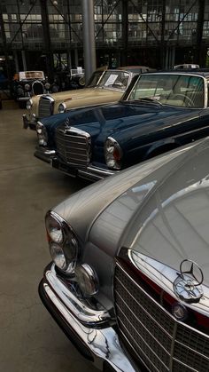 old mercedes cars are lined up in a row