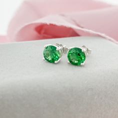 Emerald Green Stud Earrings, perfect for those born in May! The rich green color of the Emerald CZ is complimentary for every season, so these earrings would be a staple in your jewelry collection. Earrings are 4 prong set.D E T A I L S 6mm Round CZ Butterfly Push Back Sterling Silver 11mm Post Green Round Earrings For May Birthstone, Green Earrings For May Birthstone, Classic Green Round Earrings, Elegant Green Earrings As A Gift For Her, Elegant Green Earrings For Her, Green Earrings With Prong Setting As Gift, Green Prong Set Earrings As Gift, Green Prong Setting Earrings For Gift, Green Emerald Earrings For Anniversary