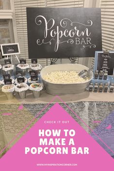 popcorn bar with sign and cupcakes on the table for how to make a popcorn bar