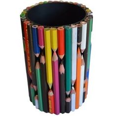 several colored pencils are arranged in the shape of a cup