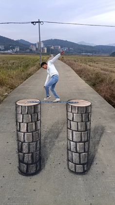 a man is balancing on two large blocks