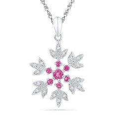 Take the frosty look of winter wherever you go with this sparkling snowflake fashion pendant. Created in sleek sterling silver, this intricate design features a detailed snowflake pattern centered with lab-created bright pink sapphires. The tips of the snowflake sparkle with shimmering diamond accents. Polished to a brilliant shine, this icy and elegant pendant suspends along an 18.0-inch rope chain and secures with a spring-ring clasp. Sterling Silver Snowflake Jewelry, White Snowflake Fine Jewelry, Sterling Silver Snowflake Jewelry For Winter, Snowflake Necklace, Snowflake Pendant, Peoples Jewellers, Elegant Pendant, Pink Stone, Lab Created Diamonds