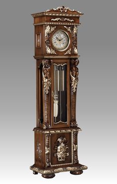 an ornate wooden grandfather clock with carvings on the front and sides, sitting against a gray background