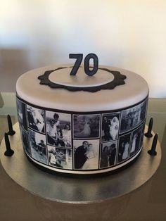 a white cake with black and white photos on it