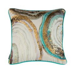 a decorative pillow with gold and blue accents