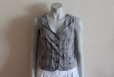 "Women's Vest Grey Vest Gray Plaid Womens Vest Checkered Waistcoat Steampunk Formal Fitted Gray Romantic Victorian Classic Cotton Small Size   Measurements (lying flat): Length(back): 19.5\"/ 49.5 cm Bust: 17 6/8\"/ 45 cm Waist: 15.5\"/ 39 cm Please check measurements to insure a proper fit. Remember to allow yourself some extra room for movement. You can compare these with something from your closet that fits you well. Condition: great  Vintage Condition SHIPPING * I ship worldwide via Priority Steampunk Formal, Gray Romantic, Grey Vest, Extra Rooms, Gray Plaid, Extra Room, Women's Vest, Womens Vest, Plaid