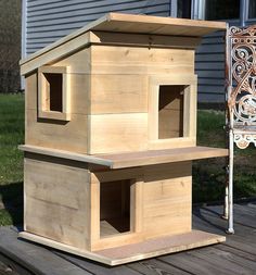 a bird house sitting on top of a wooden deck