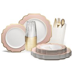 pink and gold place setting with plates, silverware and napkins on white background