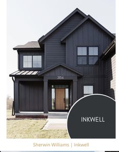 a black house with the words inkwell on it's front door and side windows