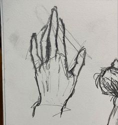 a drawing of a hand holding something in it's right hand, and another drawing of a plant on the left