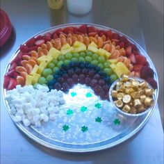 a platter filled with lots of different types of food on top of a table