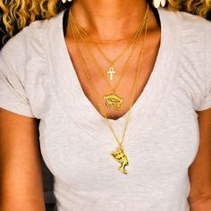 A trio of history, beauty, culture. The Silver Layered Egyptian Trio Charm Necklace features 3 of the most popular amulets of African Egyptian culture. It is perfect to wear with your favorite scoop neck blouse or turtleneck to truly display its beauty. The first layer features an Ankh charm, also known as an Egyptian cross. The second layer is the Eye of Horus charm. Associated with the moon, the Eye of Horus symbolizes good health, recovery and protection. Finally, all hail the queen, Nefertit Spiritual Charm Necklaces For Festivals, Egyptian Cross, The Eye Of Horus, Scoop Neck Blouse, Beauty Culture, Egyptian Culture, Scoop Neck Blouses, Eye Of Horus, Amulets