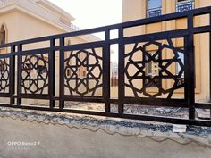 an iron gate in front of a building