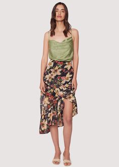 Indulge in the beauty of the Peruvian Lily Midi Skirt. This stunning skirt features an asymmetrical floral print and whimsical ruffle detail. Perfect for your next getaway, pair it with your favorite camisole for a versatile day to night look. Elevate your style and embrace your wanderlust with this must-have piece! Style #WSWC06310 Imported 93% Polyester, 7% Spandex Model is 5 ft 11 inches; Bust: 32", Waist: 23.5", Hips: 35" and wearing a size Small Runs true to size Hand wash cold, Air dry to Bohemian Party Skirt With Floral Print, Floral Print Tiered Wrap Skirt, Flowy Asymmetrical Wrap Skirt With Floral Print, Floral Print Flowy Asymmetrical Wrap Skirt, Asymmetrical Floral Print Flowy Wrap Skirt, Floral Print Tiered Flowy Wrap Skirt, Fitted Floral Print Asymmetrical Skirt, Fitted Asymmetrical Floral Print Skirt, Spring Floral Print Tiered Wrap Skirt