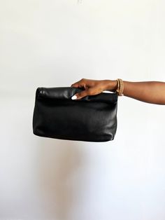 This is a gorgeous made to order high quality leather clutch bag. The bag is made of beautiful soft high quality leather. Big enough to fit your phone, sunglasses, wallet and any other essentials without being too bulky. Each bag is made to order and comes with a dust bag. This item will be shipped directly from it's maker to you. The key to sustainability is buying pieces you love, caring for them and wearing them forever. This will be one of those items for you. 100% Genuine Leather. Dimension On-the-go Rectangular Soft Leather Clutch, Black Leather-lined Pouch Clutch, Elegant Soft Leather Clutch For On-the-go, Versatile Leather Clutch With Smooth Grain, Minimalist Leather Clutch Pouch, Leather Pouch Clutch With Smooth Grain, Versatile Leather Pouch Clutch, Minimalist Leather Clutch With Removable Pouch, Black Clutch With Smooth Grain