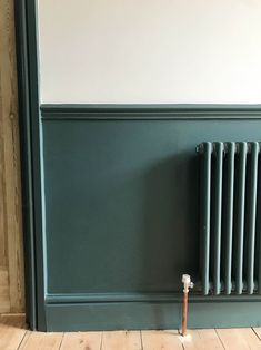 an old radiator in the corner of a room