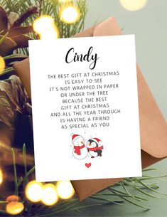 a christmas card with an image of two penguins on it and the words, candy