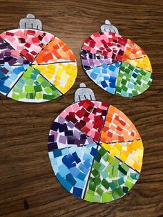 three pieces of paper that have been made to look like stained glass ornament