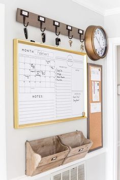 a white board with notes and clips on it next to a wall mounted air conditioner