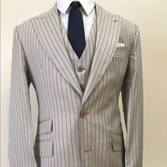 Stunning Cashmere Ivory Blue Pinstripe Super 150 Ariston Wool Suit. Ticket Pocket, 10 Inch Double Vent, 4.5 Inch Hand Stitched Peak Lapel. Flat Front Pant. Made In Italy. This Brand New Suit Will Exceed Your Expectations Or Return For Full Refund. Sells For $2600-$3200 At The Stores I Wholessle To. Luxury Striped Single Breasted Suits, Elegant Tailored Blazer With Vertical Stripes, Classic Fitted Cream Three-piece Suit, Elegant Striped Fitted Suit, Elegant Fitted Striped Suits, Elegant Fitted Suit With Vertical Stripes, Classic Striped Single Breasted Suit, Classic Fitted Striped Suits, Classic Striped Fitted Suit