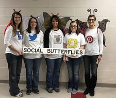 four girls in white shirts are holding a social butterfly banner with the words social butterflies on it