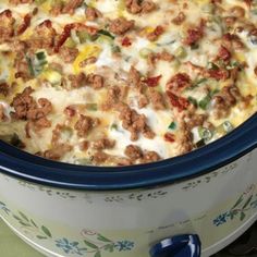 a casserole dish with meat and vegetables in it on the stove top, ready to be eaten