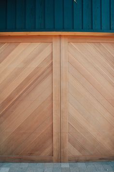 a pair of wooden doors on a building