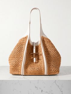 EXCLUSIVE AT NET-A-PORTER. Artisanal techniques and a keen fabric selection process elevate Tod's signature bags beyond the everyday. Sized to house your essentials, this 'T Timeless' style is woven from hard-wearing raffia and finished with supple leather trims, plus a removable zipped pouch. The generous drop means you can carry heavy cargo comfortably. Tods Bag, Denim Flats, Flat Dress Shoes, Floral Dresses Short, Dress Flats, Raffia Bag, Looks Chic, Fine Jewelry Designers, Ski Wear