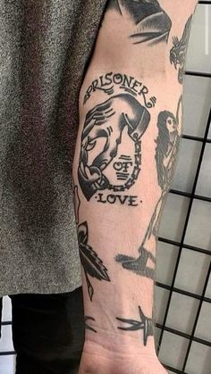 a man's arm with tattoos on it and the words prisoner love written in black ink