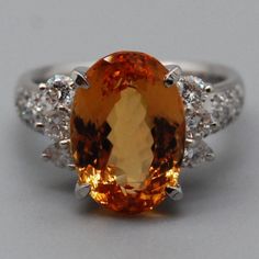 Metal:Platinum                           Metal Purity: Pt. 900 Hallmark:  Pt. 900 0.60 D 7.44 Size:6 Width (inches/mm ):0.68 / 17.5 Weight ( gram ):9.4 Condition:New Without Tag Formal Yellow Diamond Gemstones, Formal Orange Topaz Ring With Diamond, Orange Diamond Ring With Prong Setting, Formal Orange Diamond Ring, Citrine Jewelry, Platinum Metal, Yellow Sapphire, Cocktail Ring, Cocktail Rings