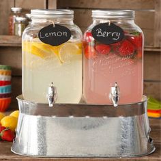 two mason jars filled with lemonade and raspberry punch