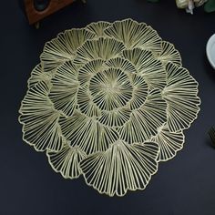 a table topped with plates and utensils on top of a black countertop