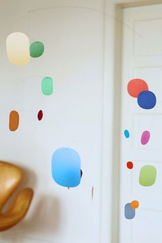 the wall is decorated with multicolored circles