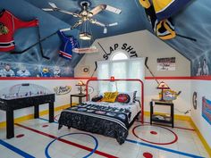 a bedroom with hockey themed walls and flooring, including a bed in the center